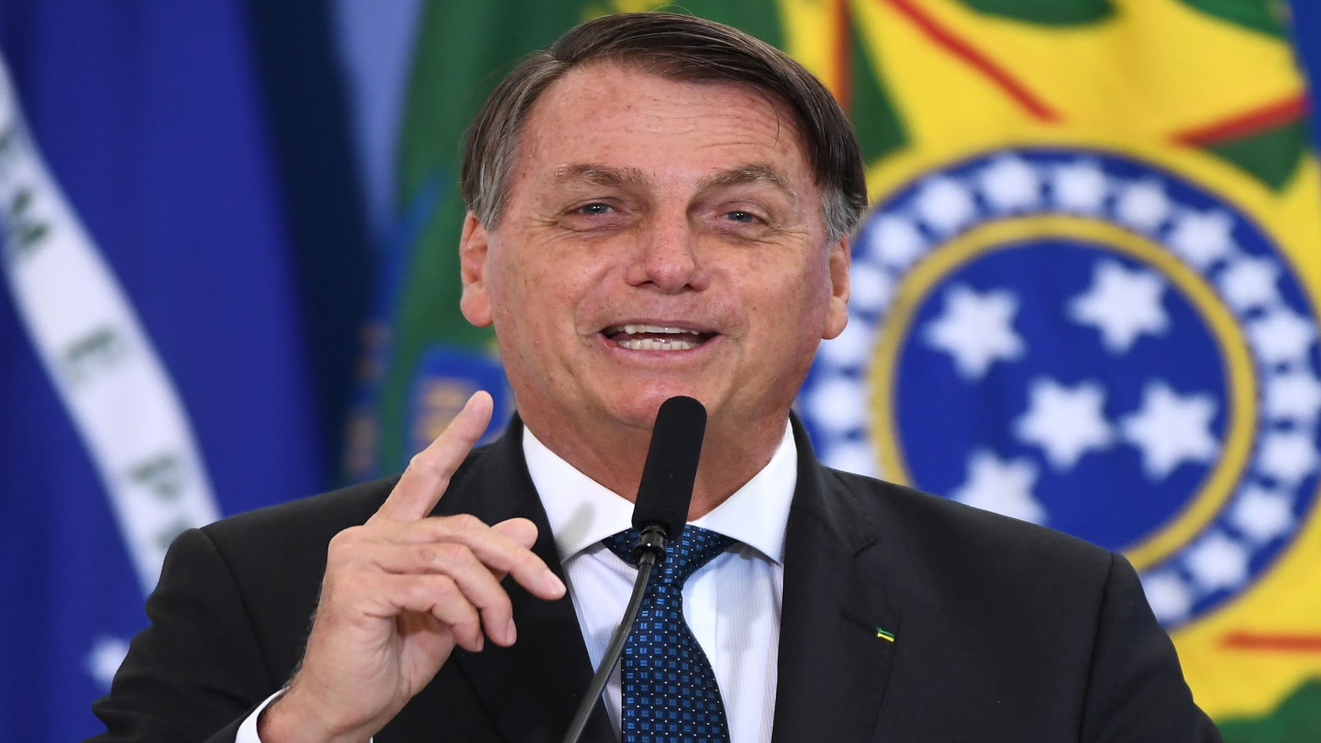 Image for the title: Brazil's Bolsonaro says rush for coronavirus vaccine not justified 