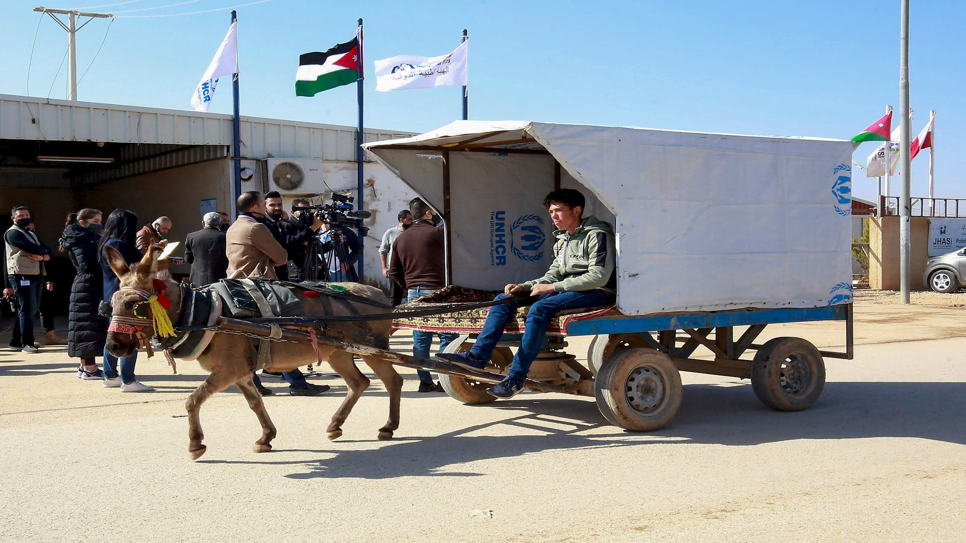 Image for the title: Jordan starts 'world first' Covid vaccinations in refugee camp 