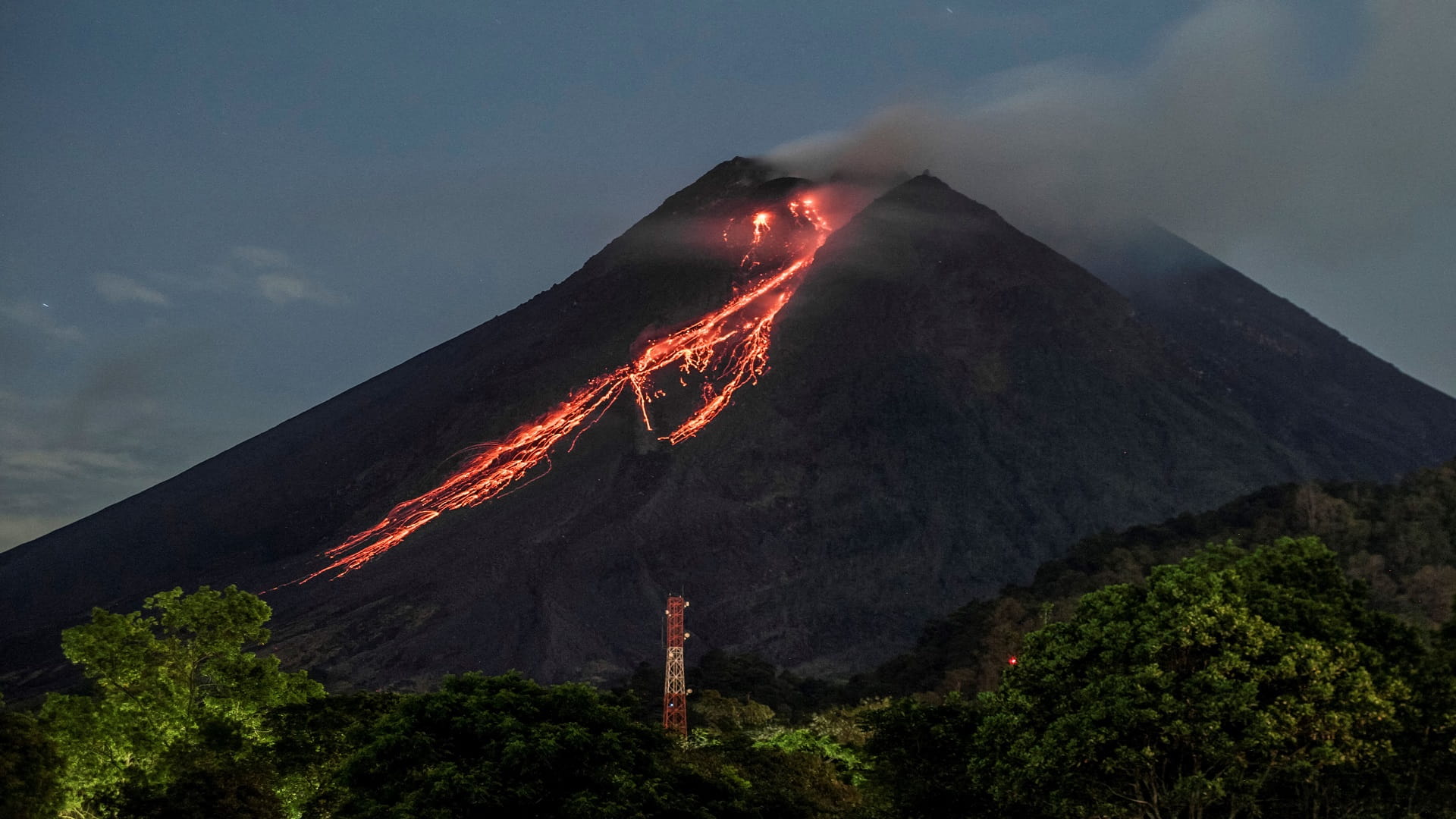 Image for the title: Indonesia volcano erupts, spews red-hot lava 