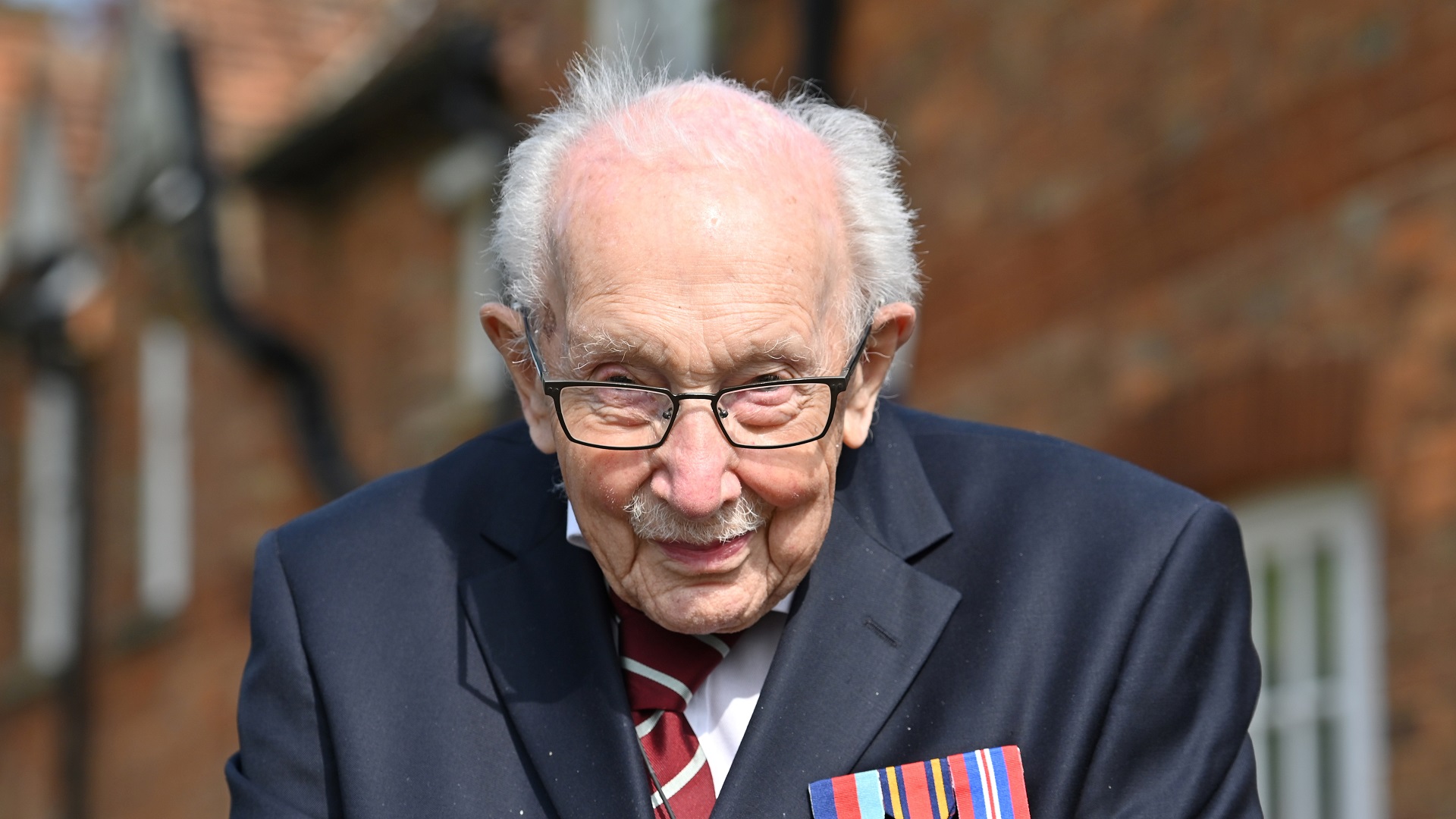 Image for the title: UK lockdown hero 'Captain Tom' dies at 100: family 