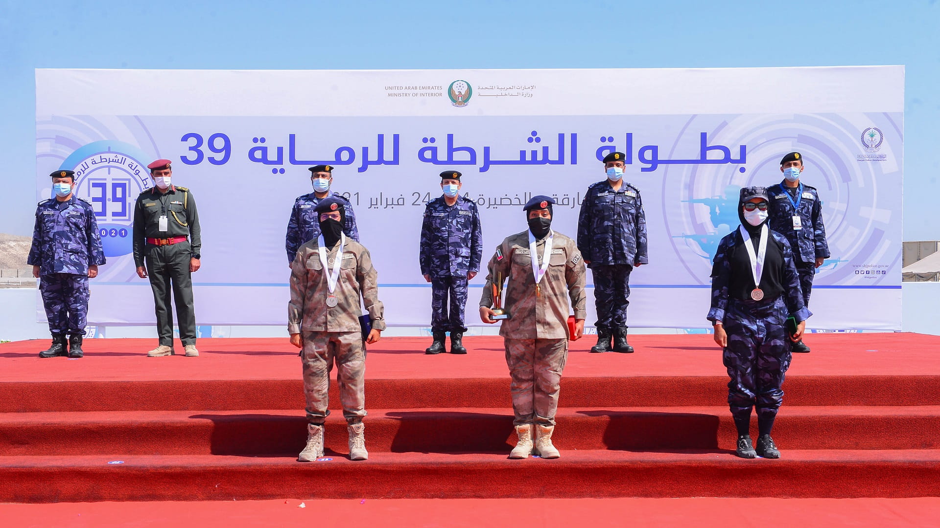 Image for the title: Al Kaabi honours the winners of the rifle shooting competition 