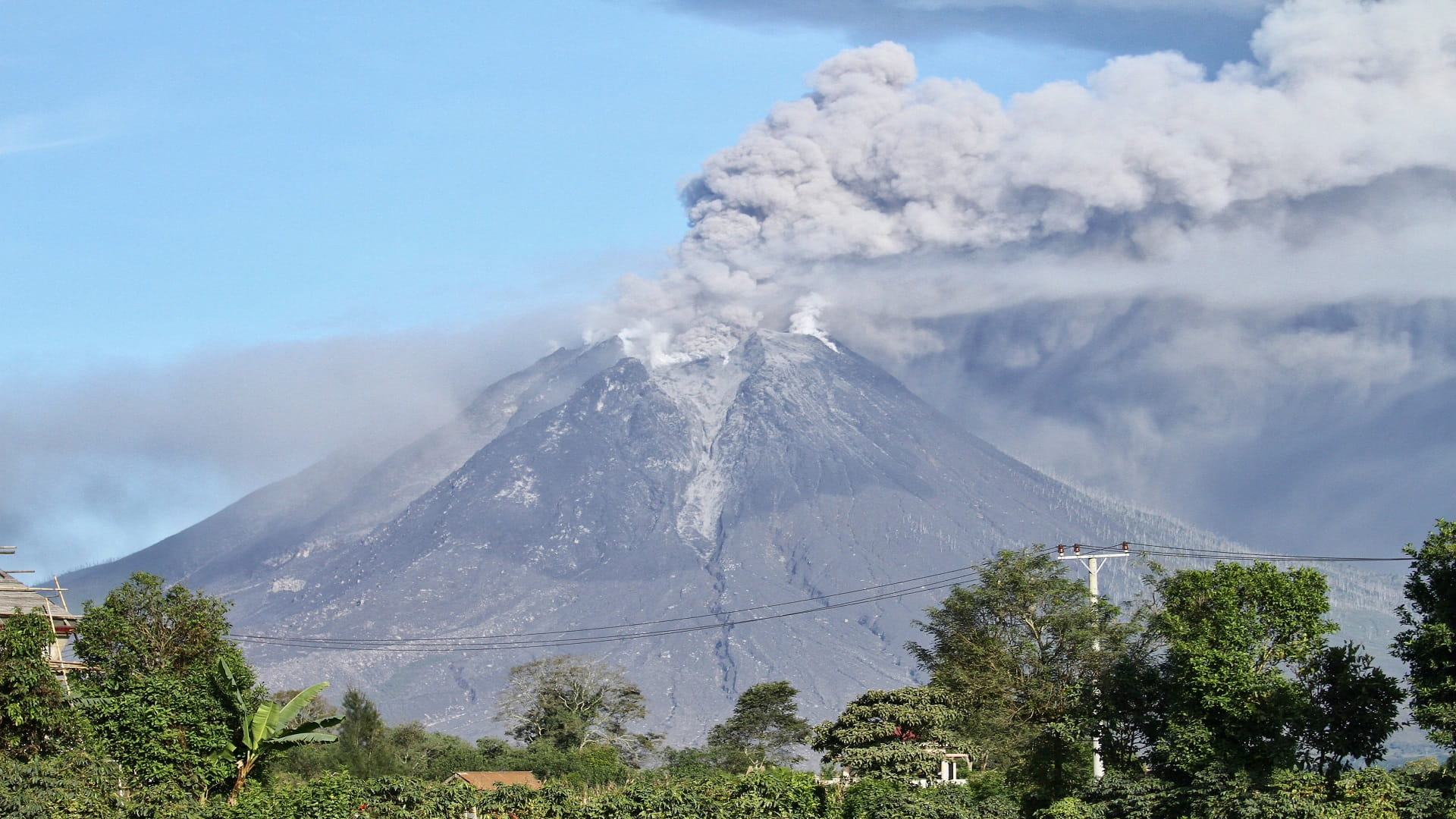 Image for the title: Indonesia's Mount Sinabung ejects ash 1,500 metres into sky 