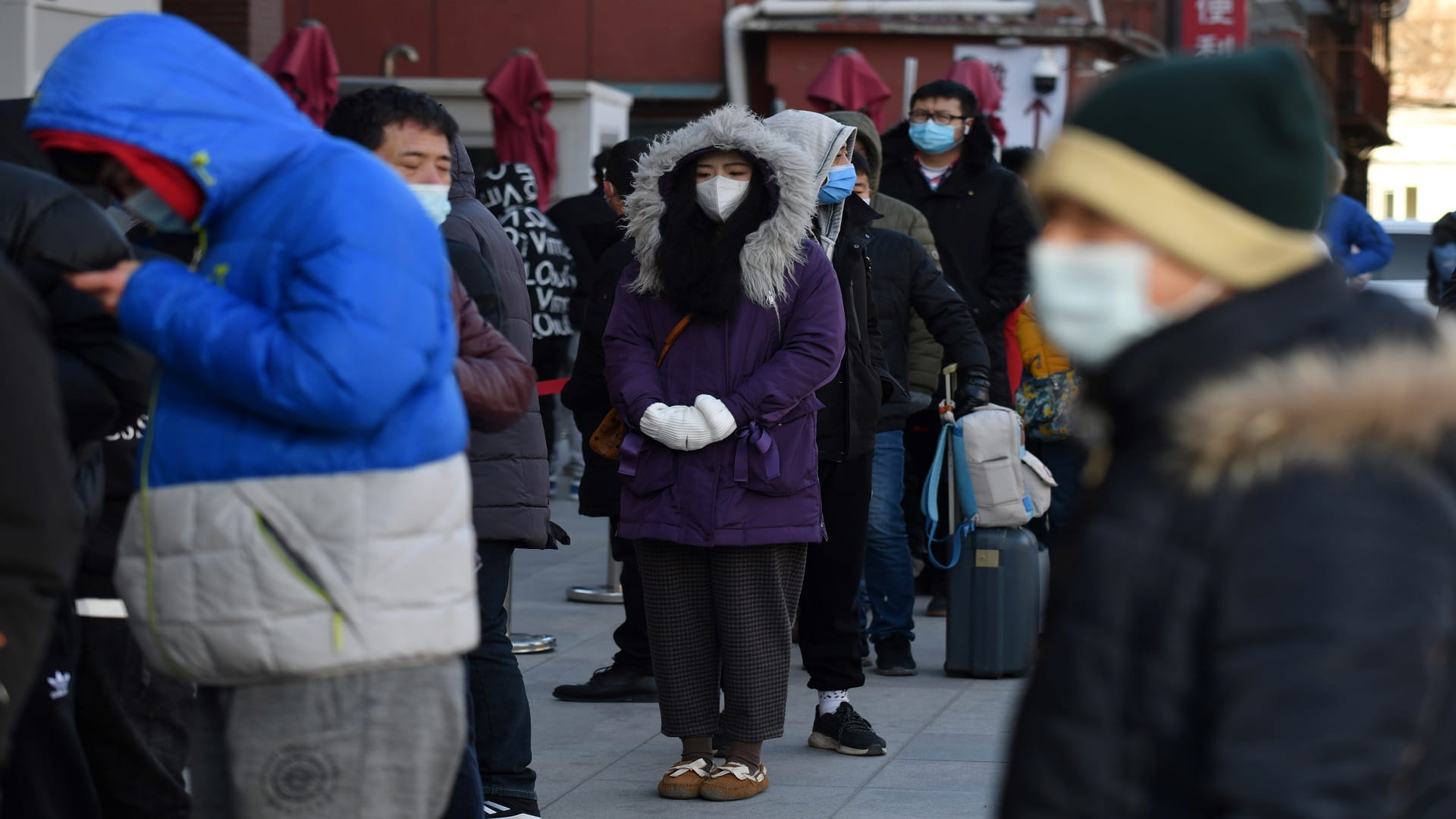 Image for the title: China steps up COVID-19 measures as local infections rise 