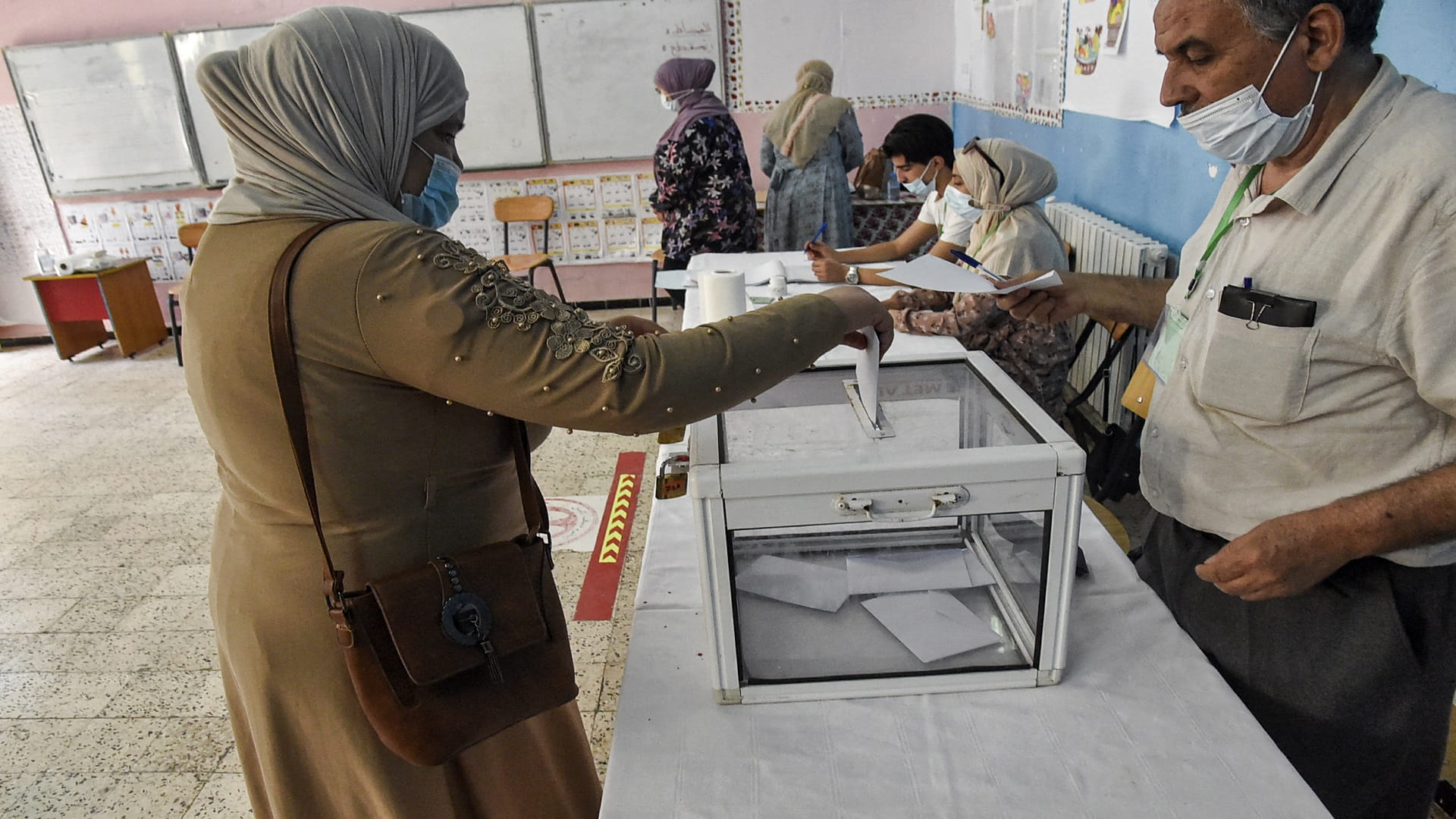 Image for the title: Algeria's parl elections kick off with new electoral system 