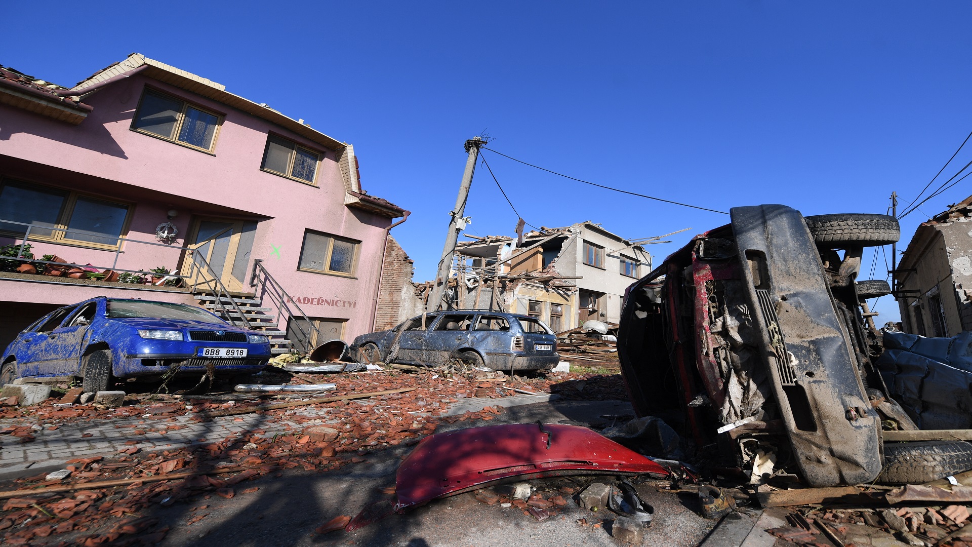 Image for the title: Three dead, dozens injured as rare tornado razes Czech homes 