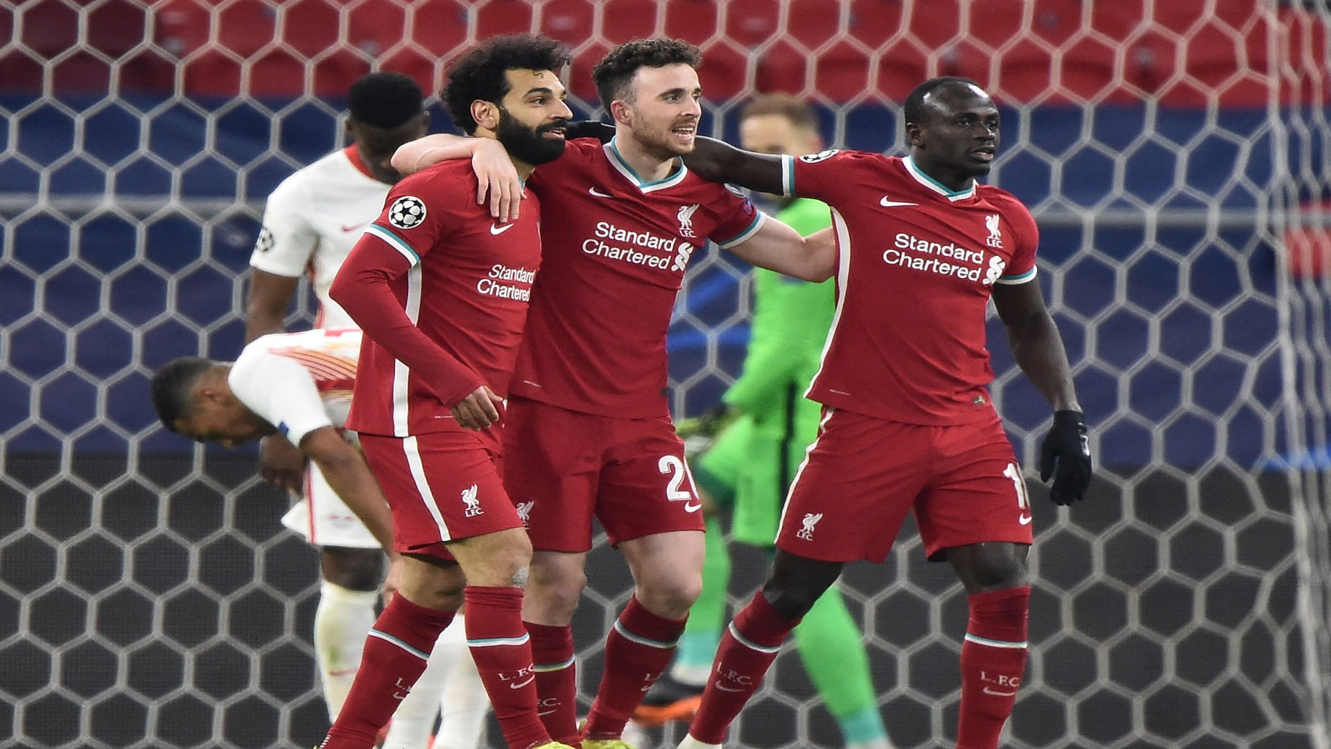 Image for the title: Salah and Mane fire Liverpool past Leipzig into quarters 