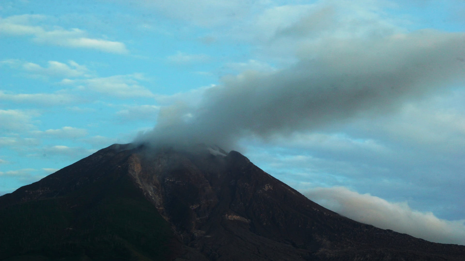 Image for the title: Indonesia's Mount Sinabung volcano spews ash into sky 