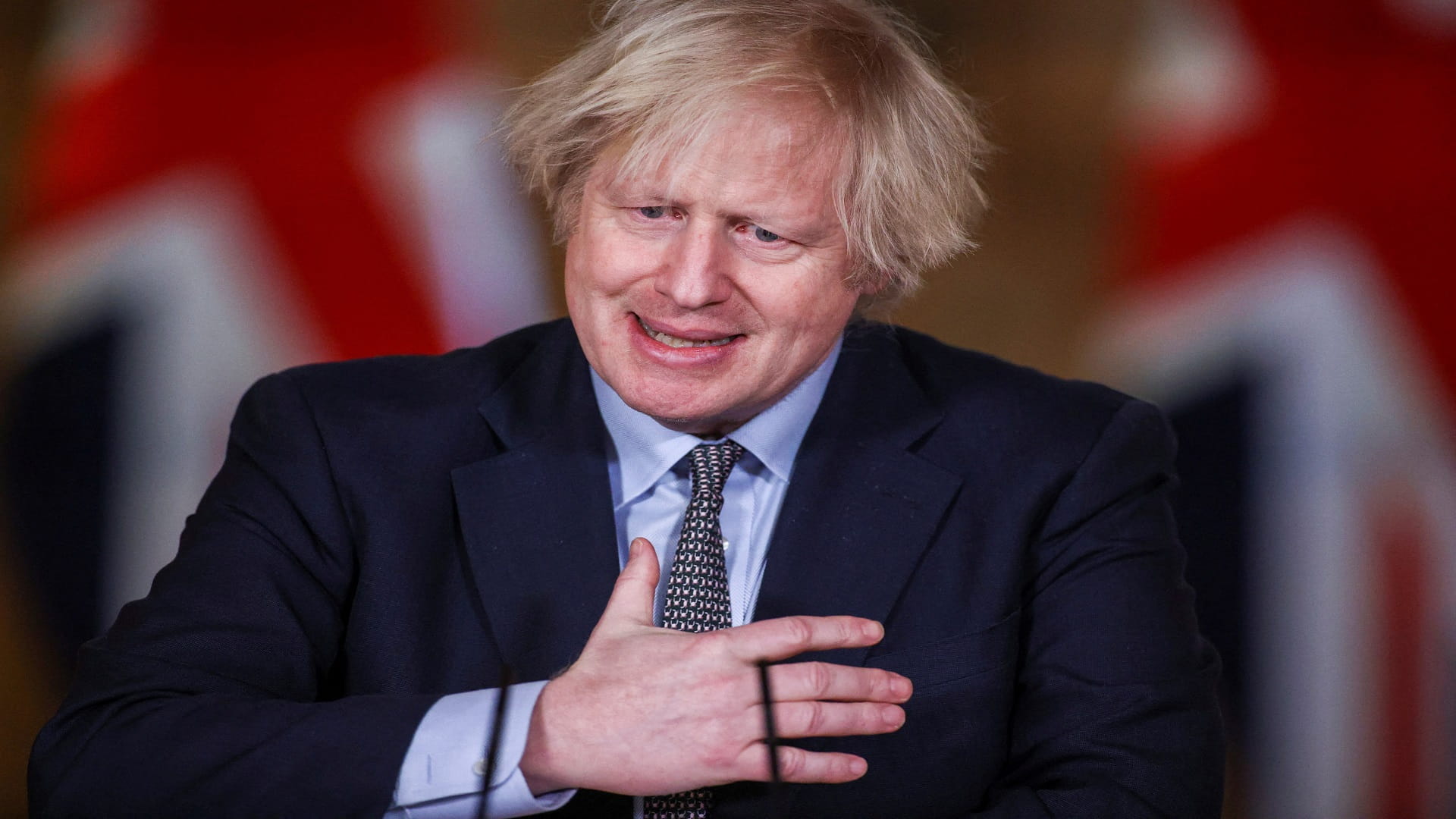 Image for the title: UK's Johnson urges caution as some lockdown measures ease 