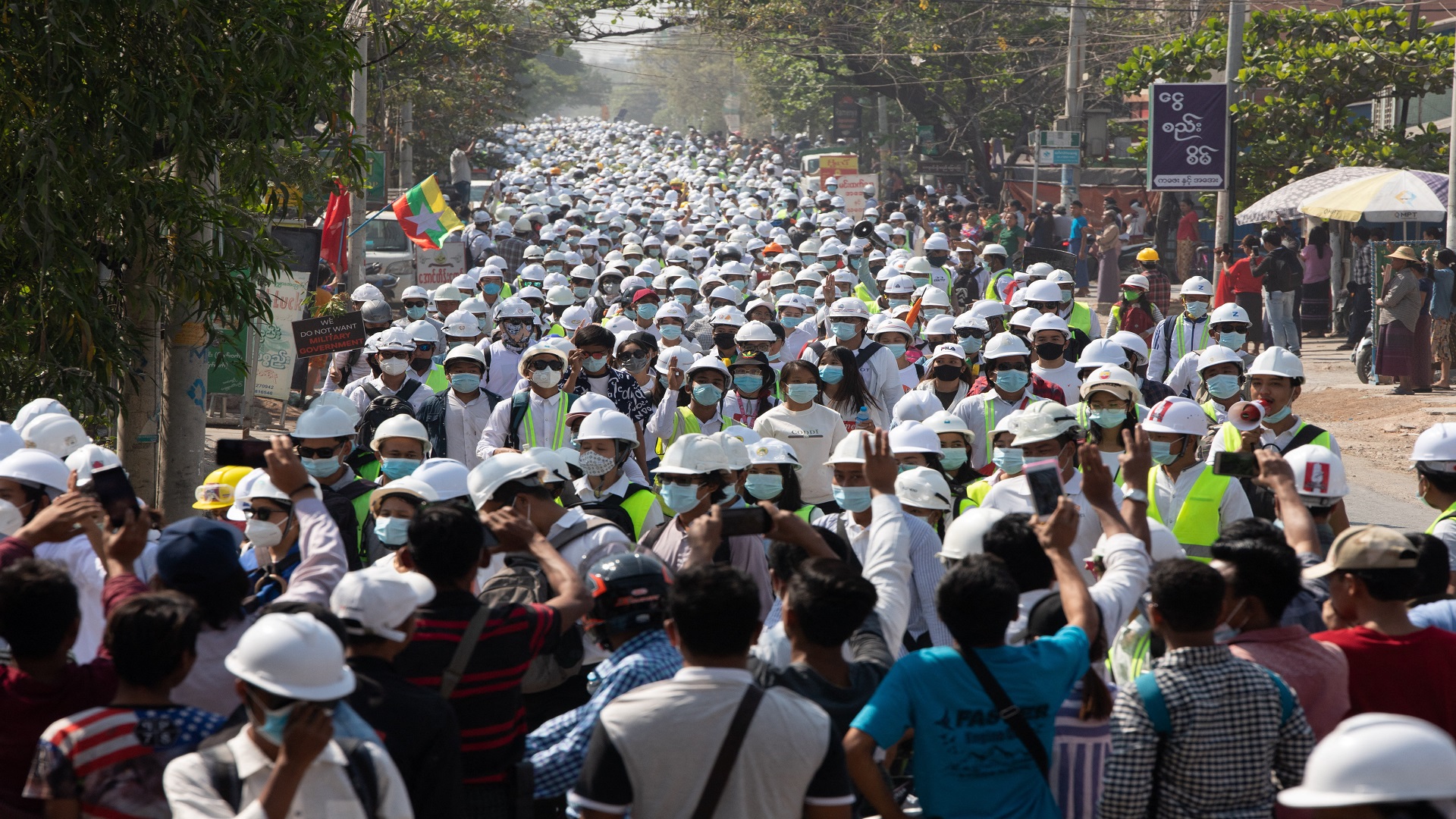 Image for the title: Myanmar forces make night raids after breaking up protests 