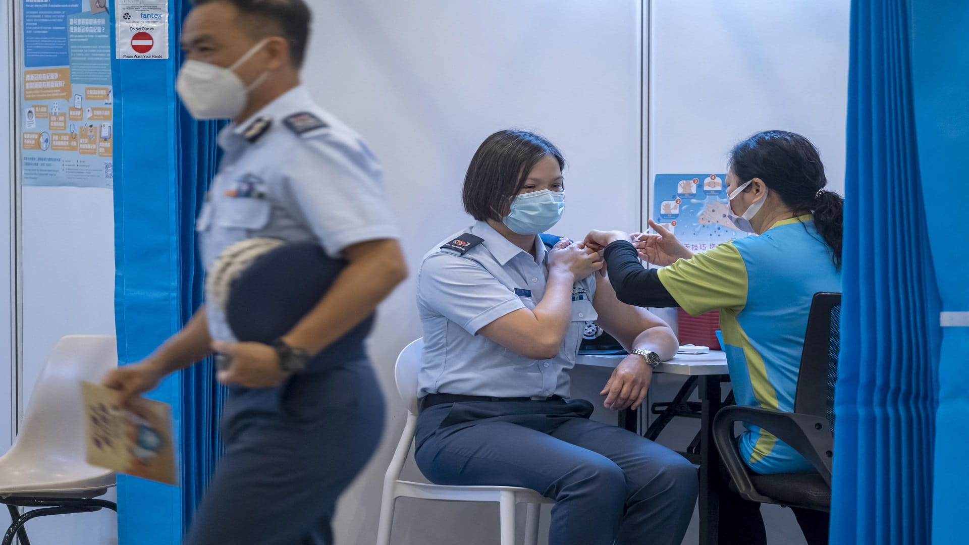 Image for the title: Hong Kong expands vaccine programme to teachers, taxi drivers 