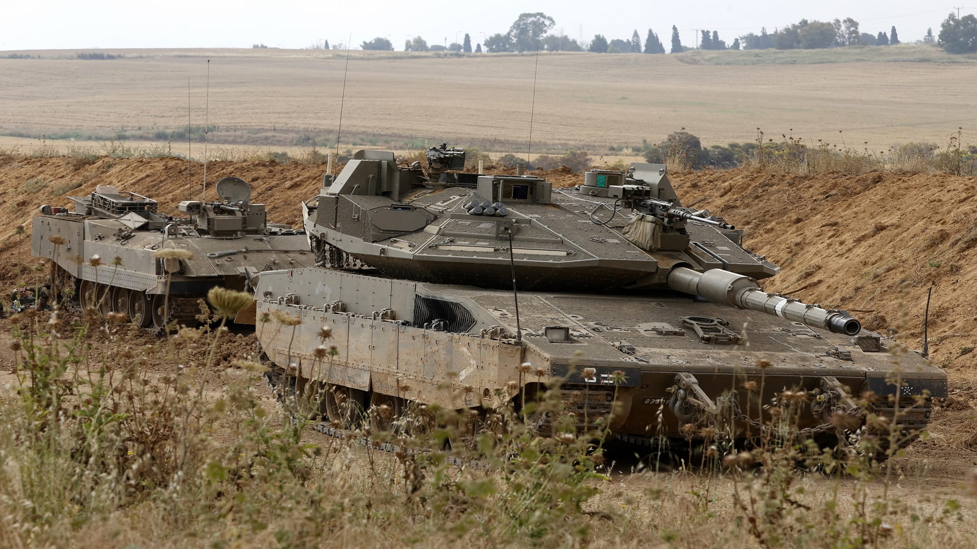 Image for the title: Israeli troops mass along Gaza border amid tension 