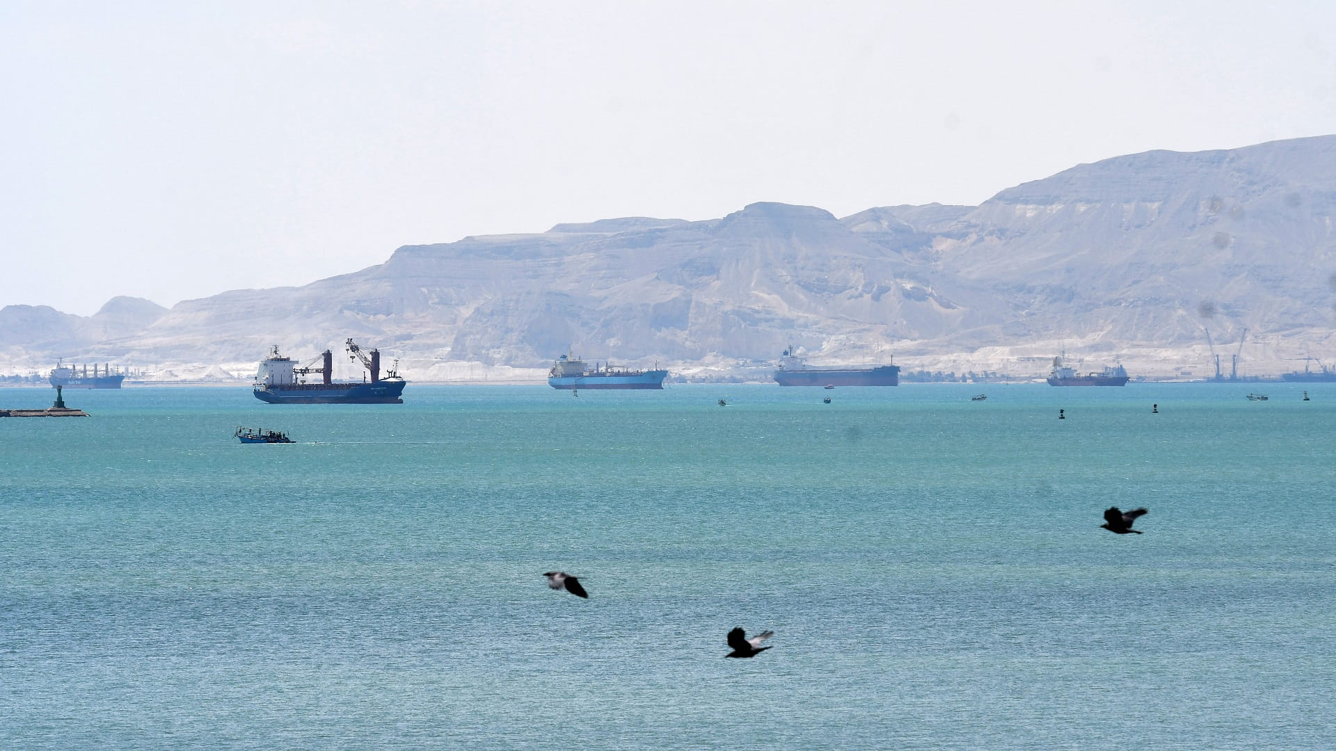 Image for the title: Suez Canal starts dredging work to extend double lane 