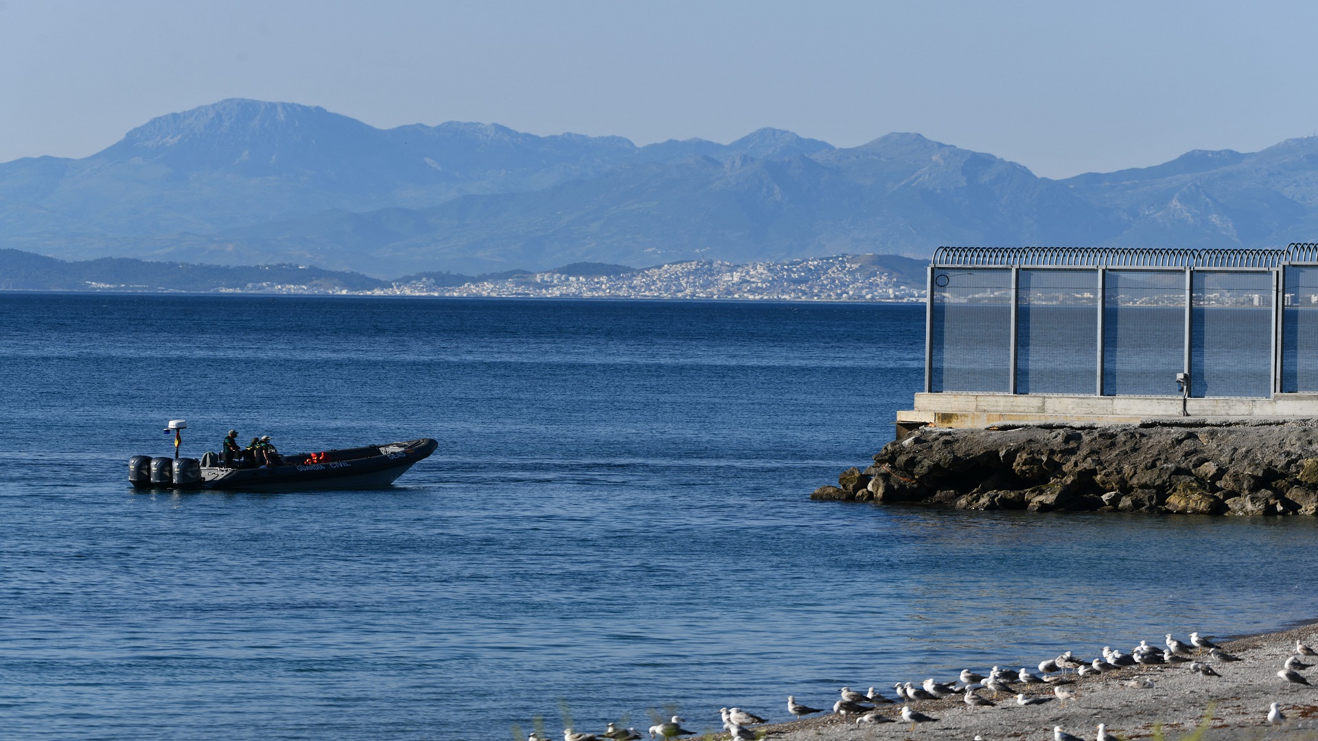 Image for the title: Record 5,000 migrants reach Spain's Ceuta enclave in one day 