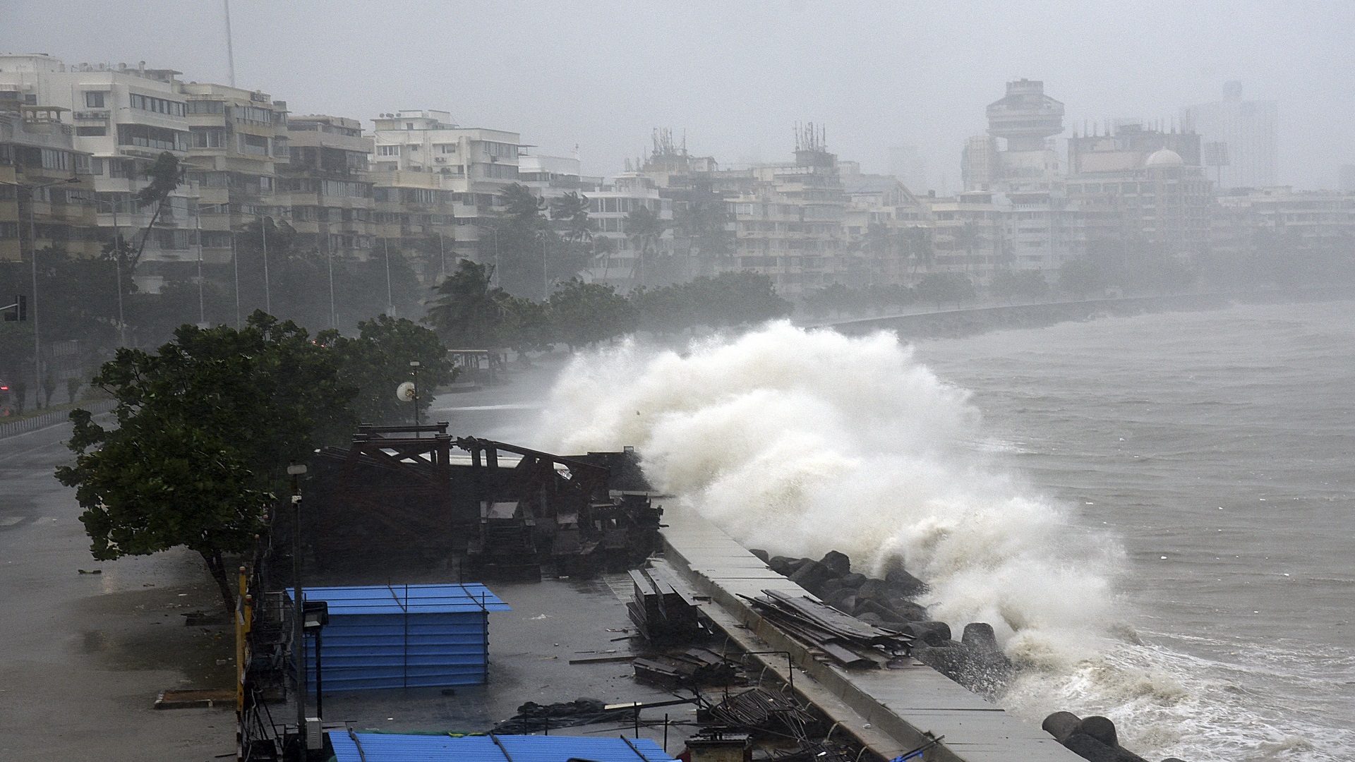 Image for the title: Powerful storm weakens slightly after landfall in western India 