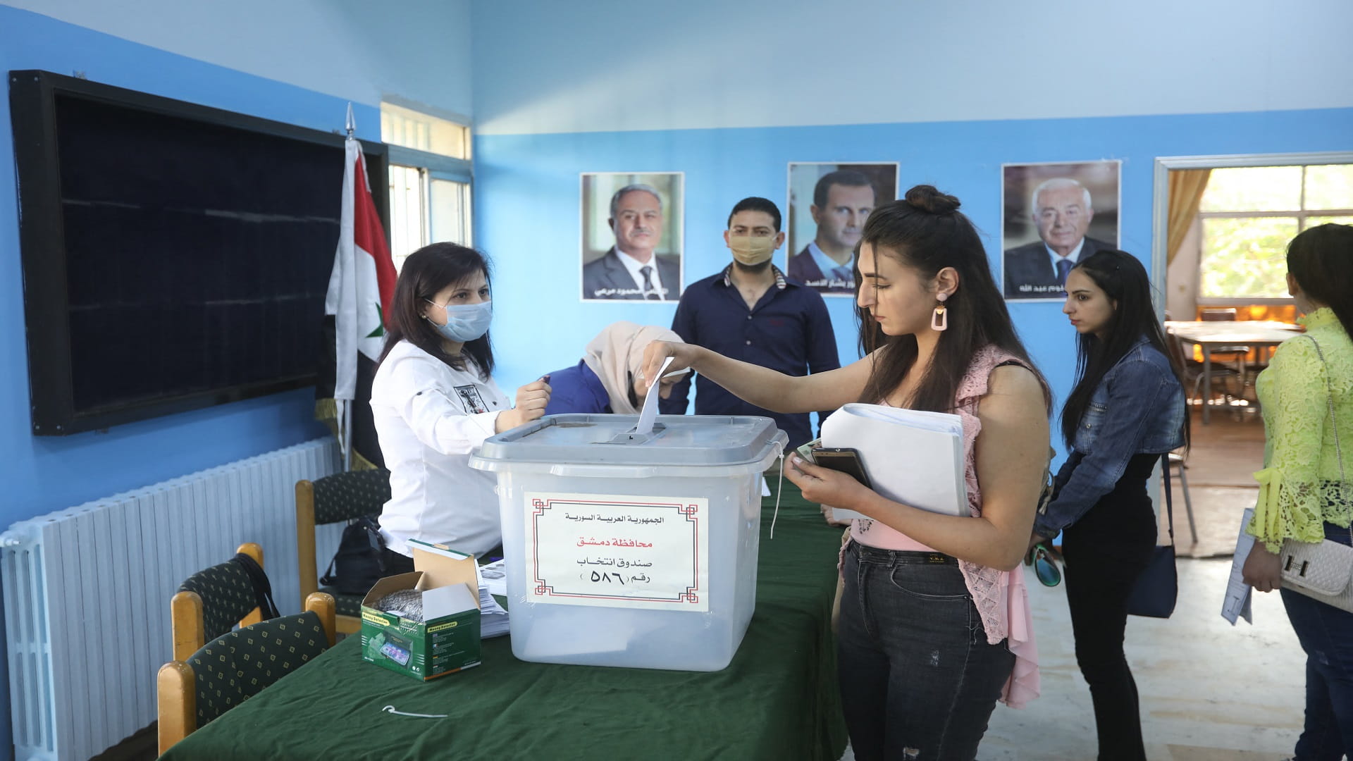 Image for the title: Syria polling stations open as Assad seeks fourth term 