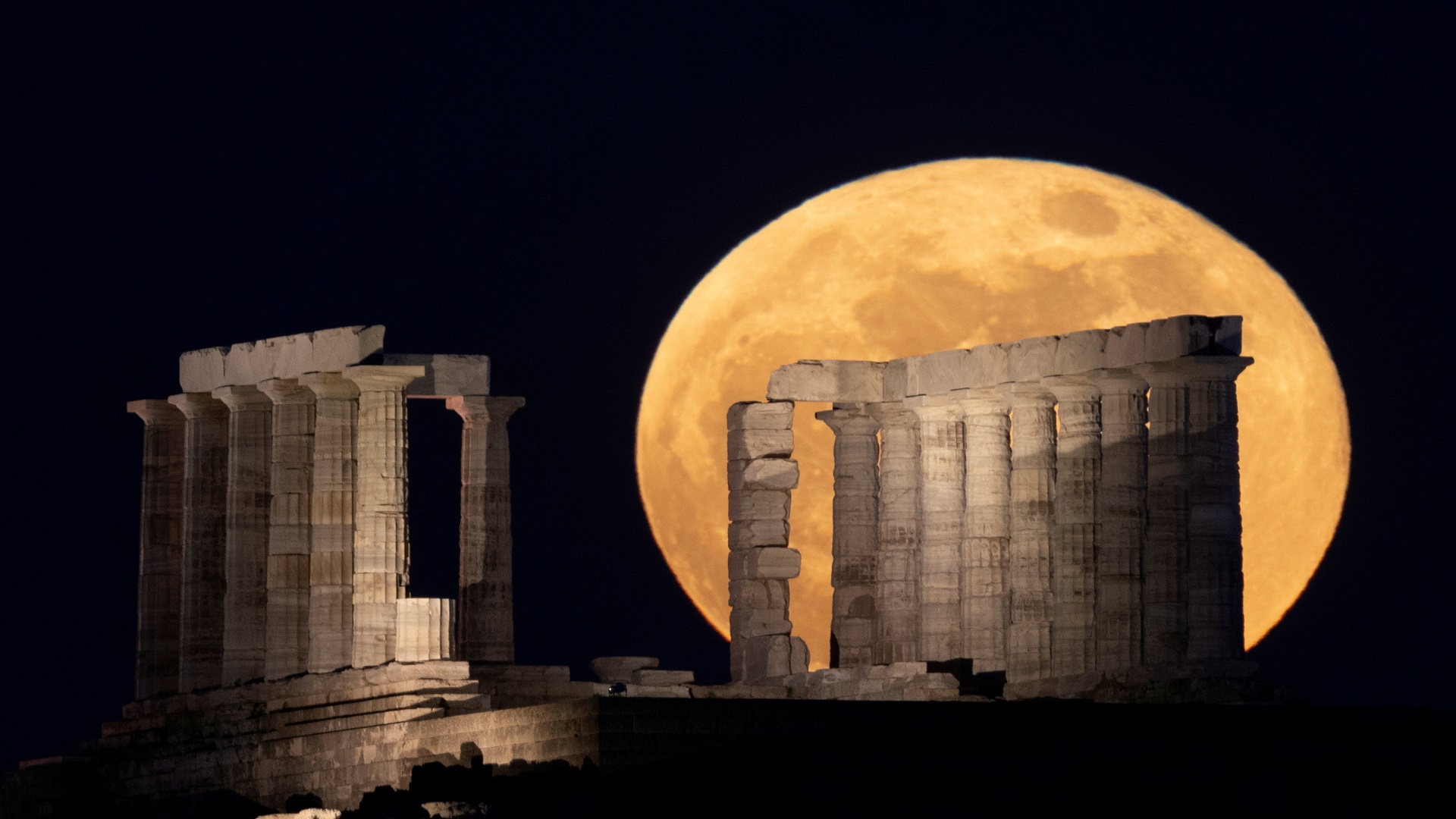 Image for the title: Super Flower Moon rises in clear sky over Sydney Opera House 