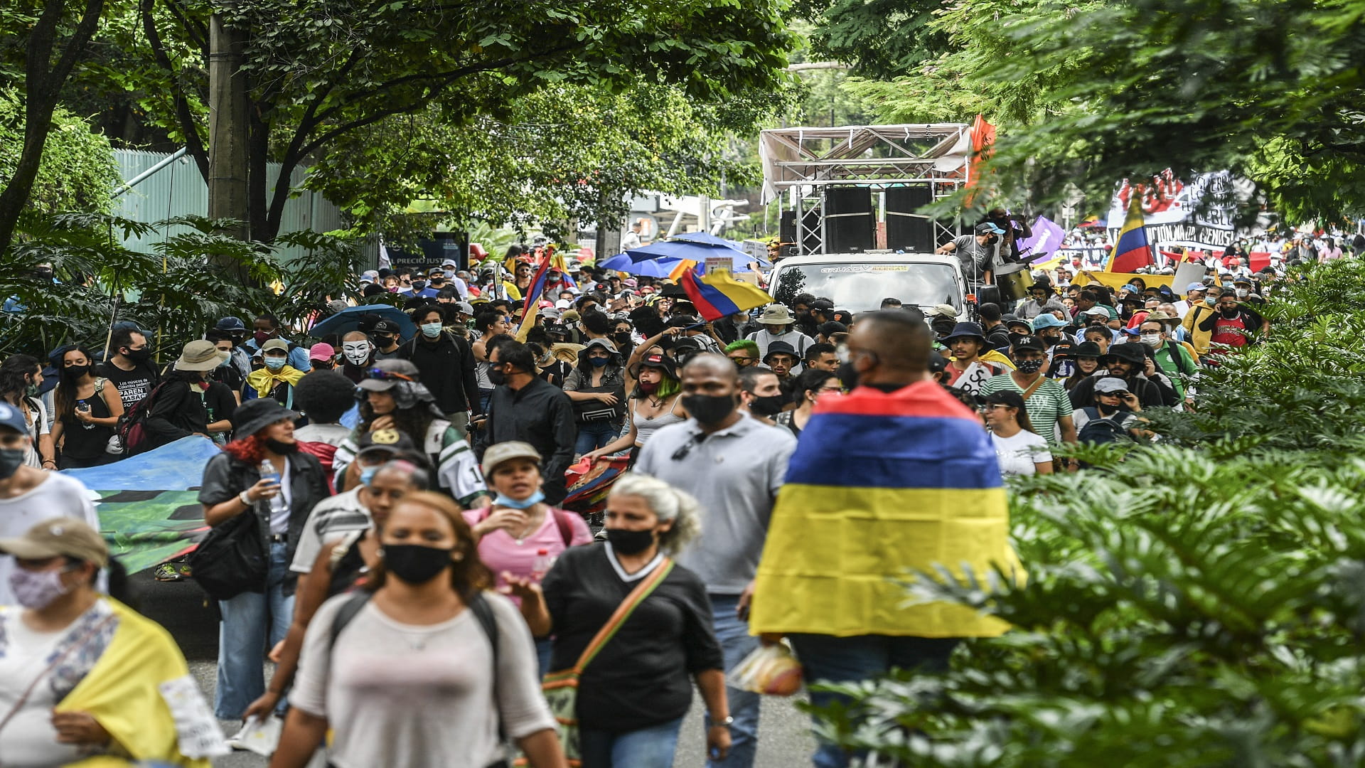 Image for the title: Colombian protesters march demanding economic aid, social change 