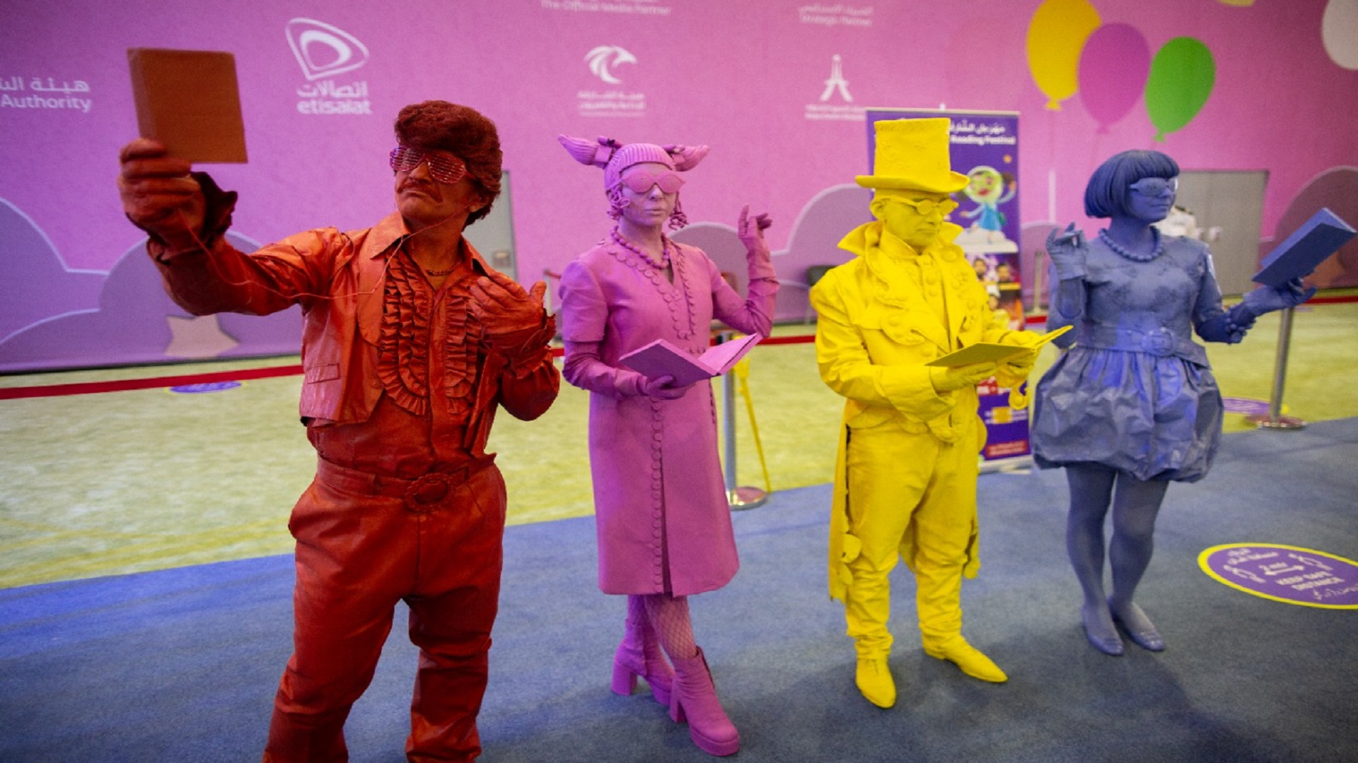 Image for the title: Colorful characters entertain visitors with silent act at SCRF 