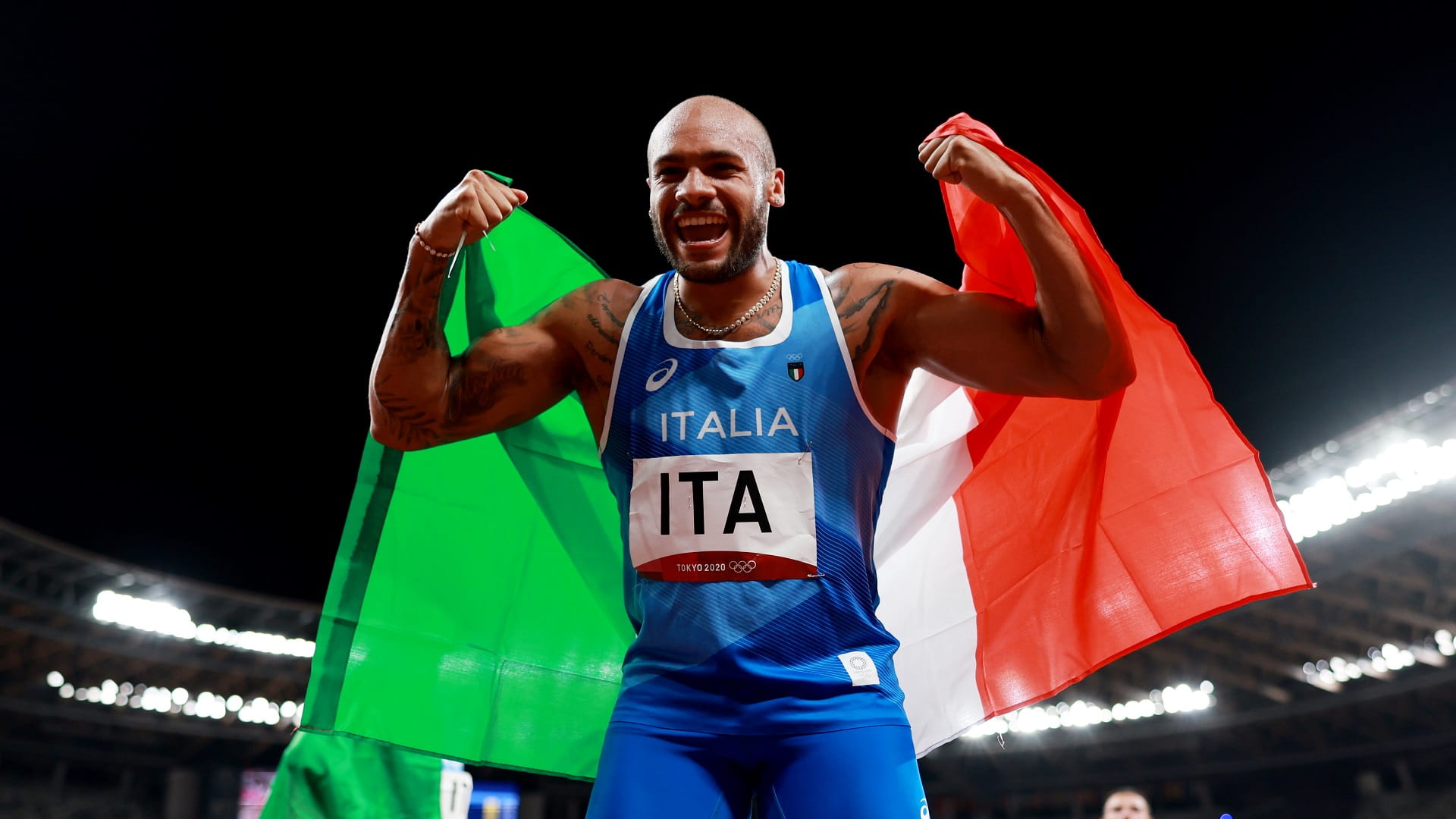 Image for the title: Italy win first ever Olympic men's 4x100 metres relay title 