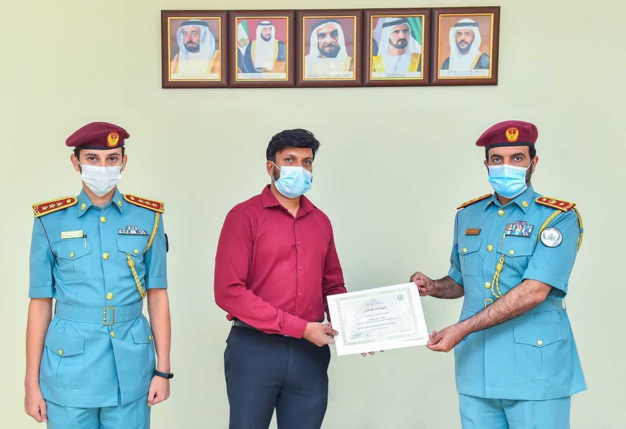 Image for the title: Sharjah Community Police honours a resident for his honesty 