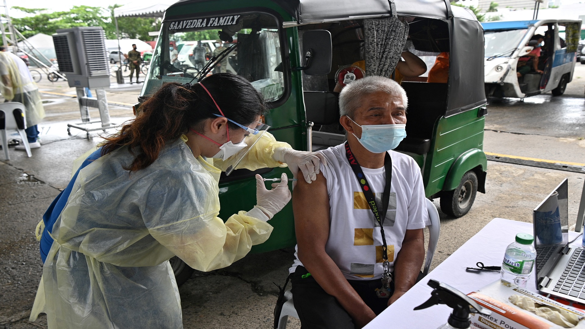 Image for the title: Philippines reports biggest jump in virus death toll in 4 months 