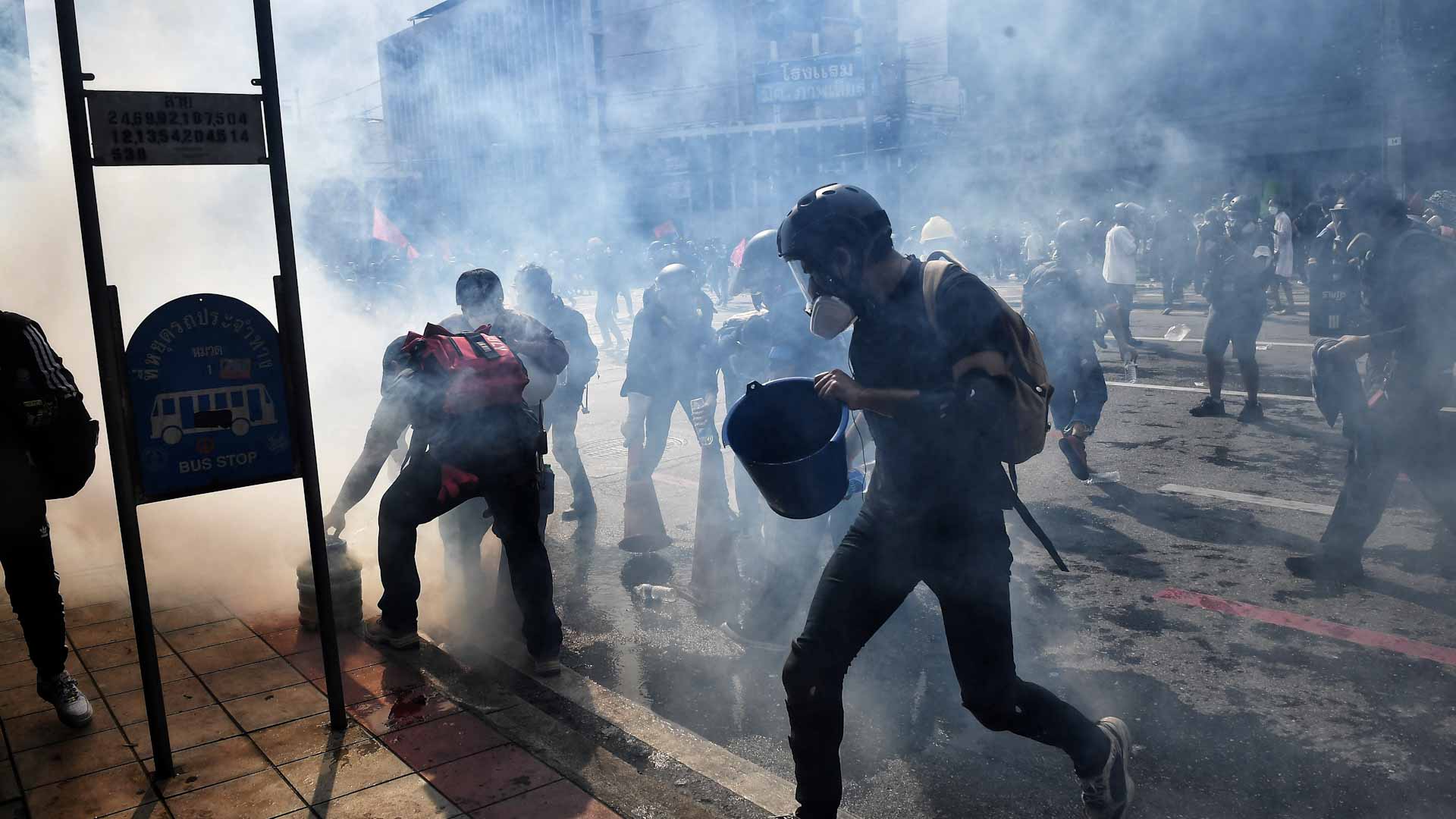 Image for the title: Thai police fire tear gas, rubber bullets at protesters 