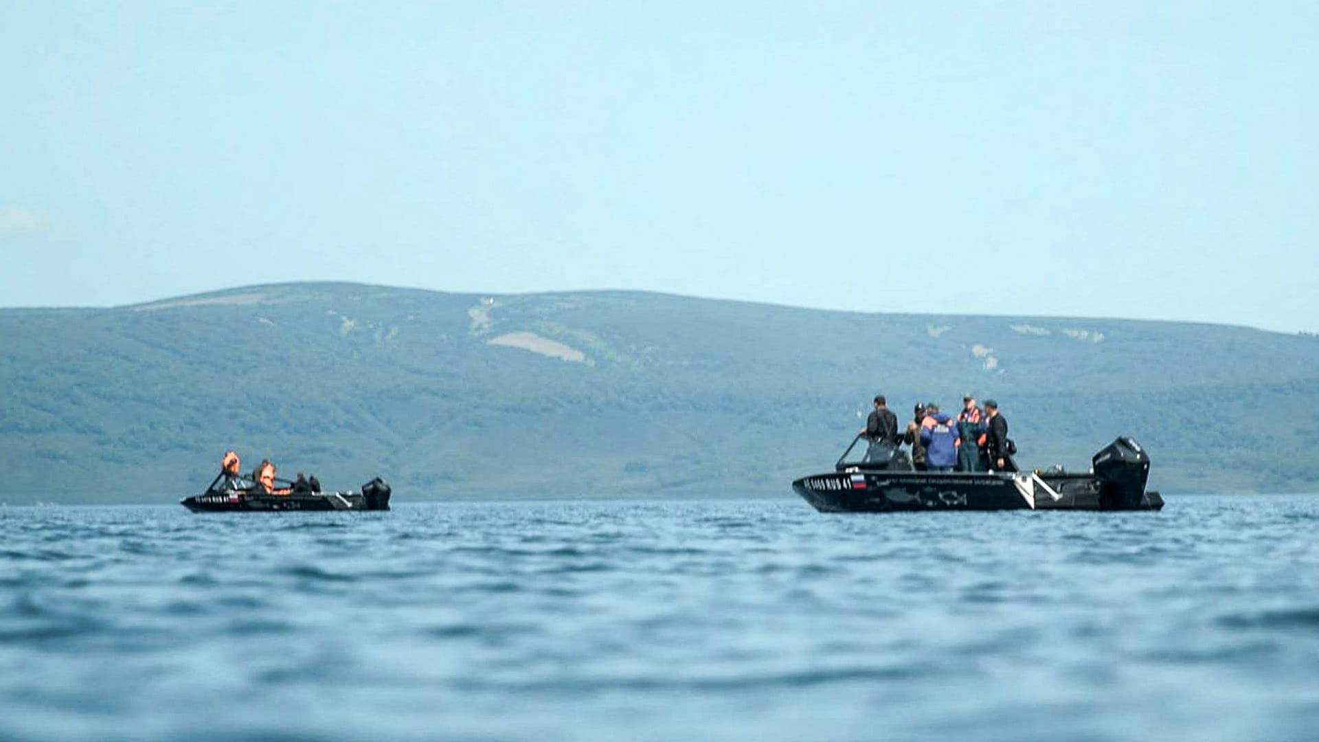 Image for the title: Eight feared dead as Russia tourist helicopter crashes into lake 