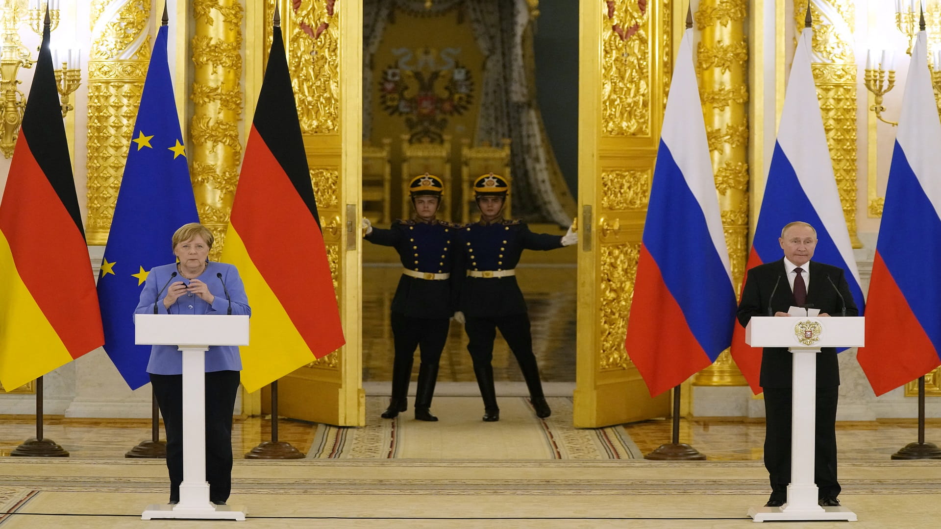 Image for the title: Putin, after Merkel talks, denies Navalny's jailing was political 
