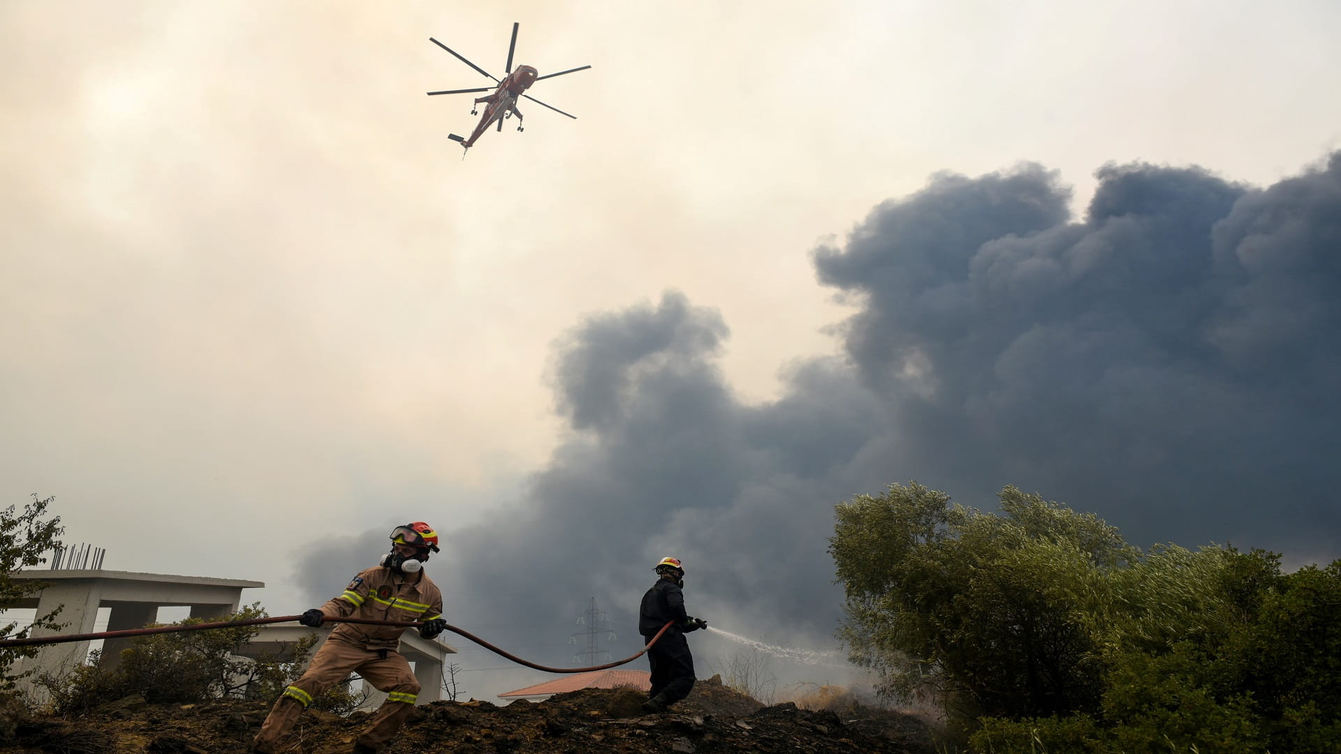 Image for the title: Villagers evacuated as forest fire spreads near Athens 