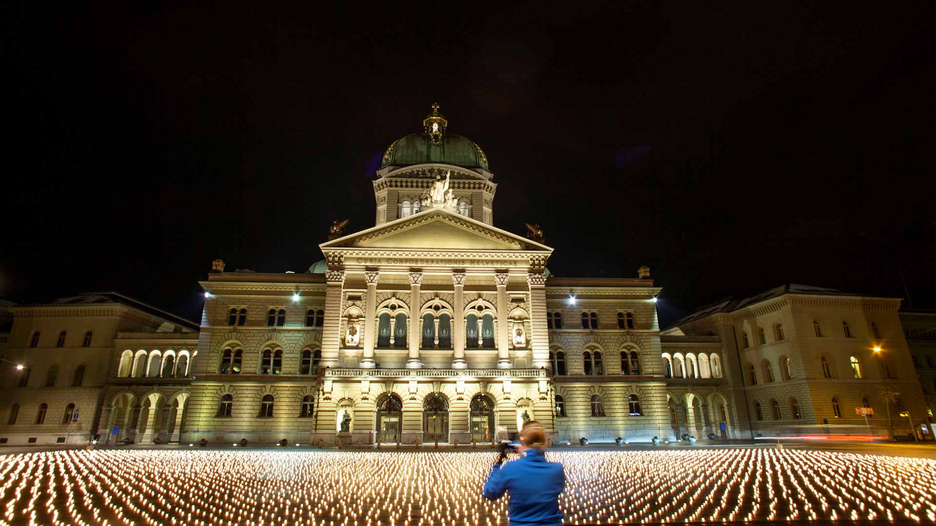 Image for the title: Swiss group lights 11,288 candles for COVID-19 victims 