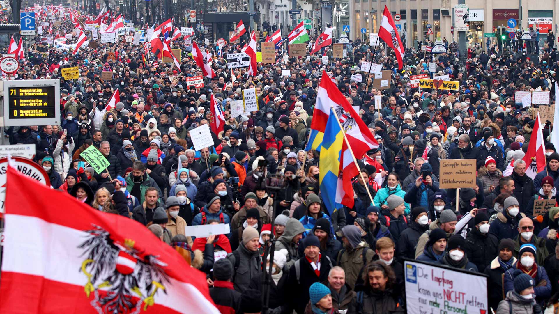 Image for the title: Mass protest in Vienna against controversial COVID restrictions 