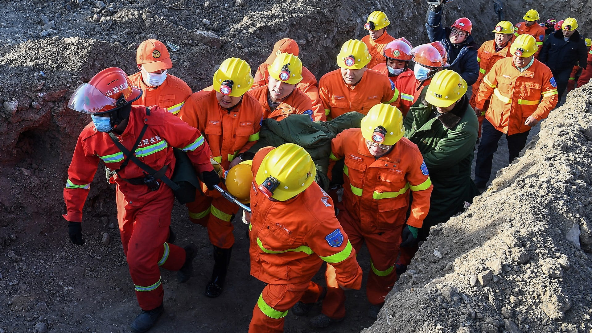 Image for the title: Rescuers to save last trapped Chinese miner as 20 pulled free 