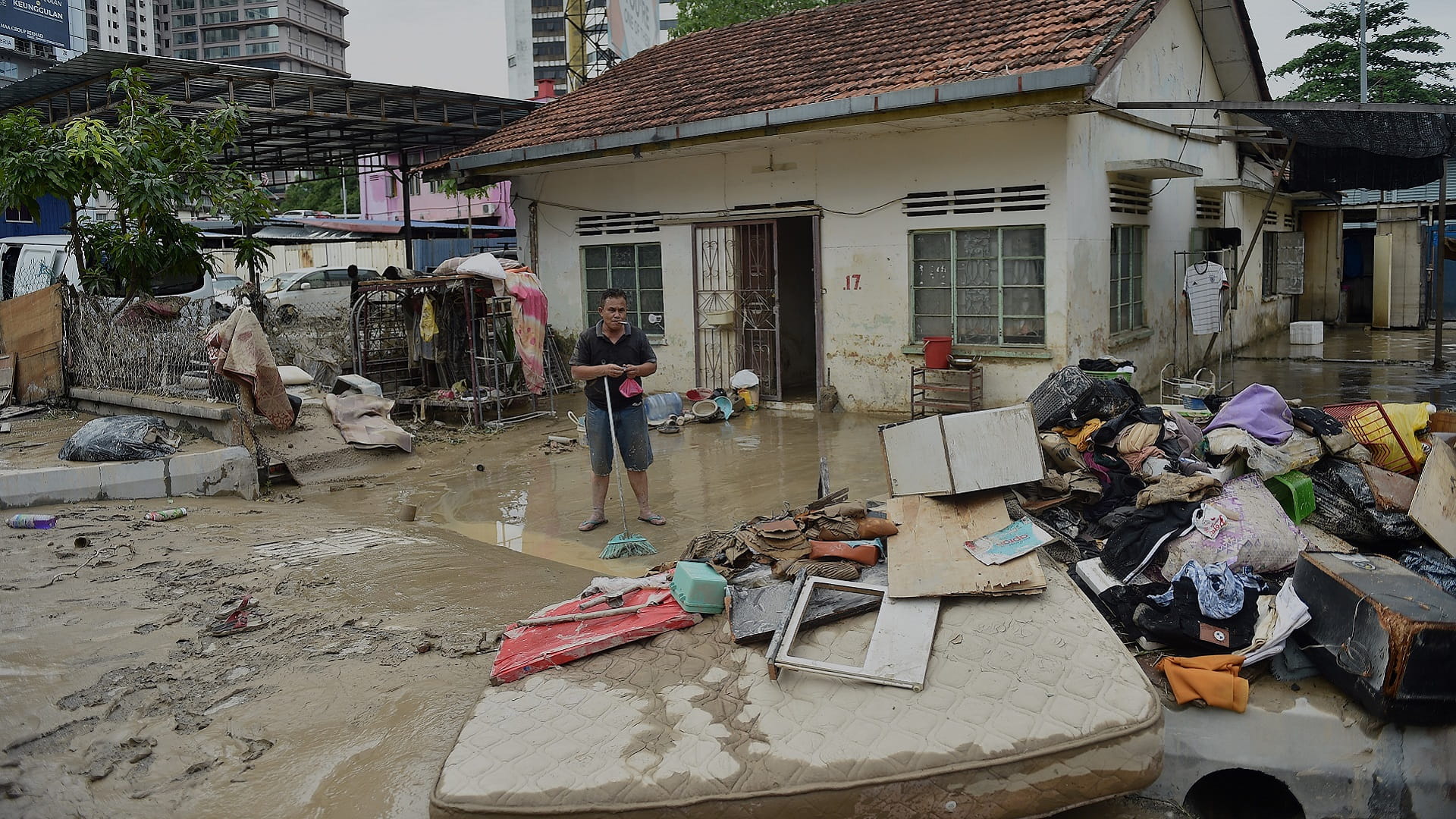 Image for the title: More than 50,000 forced from homes in Malaysian floods 