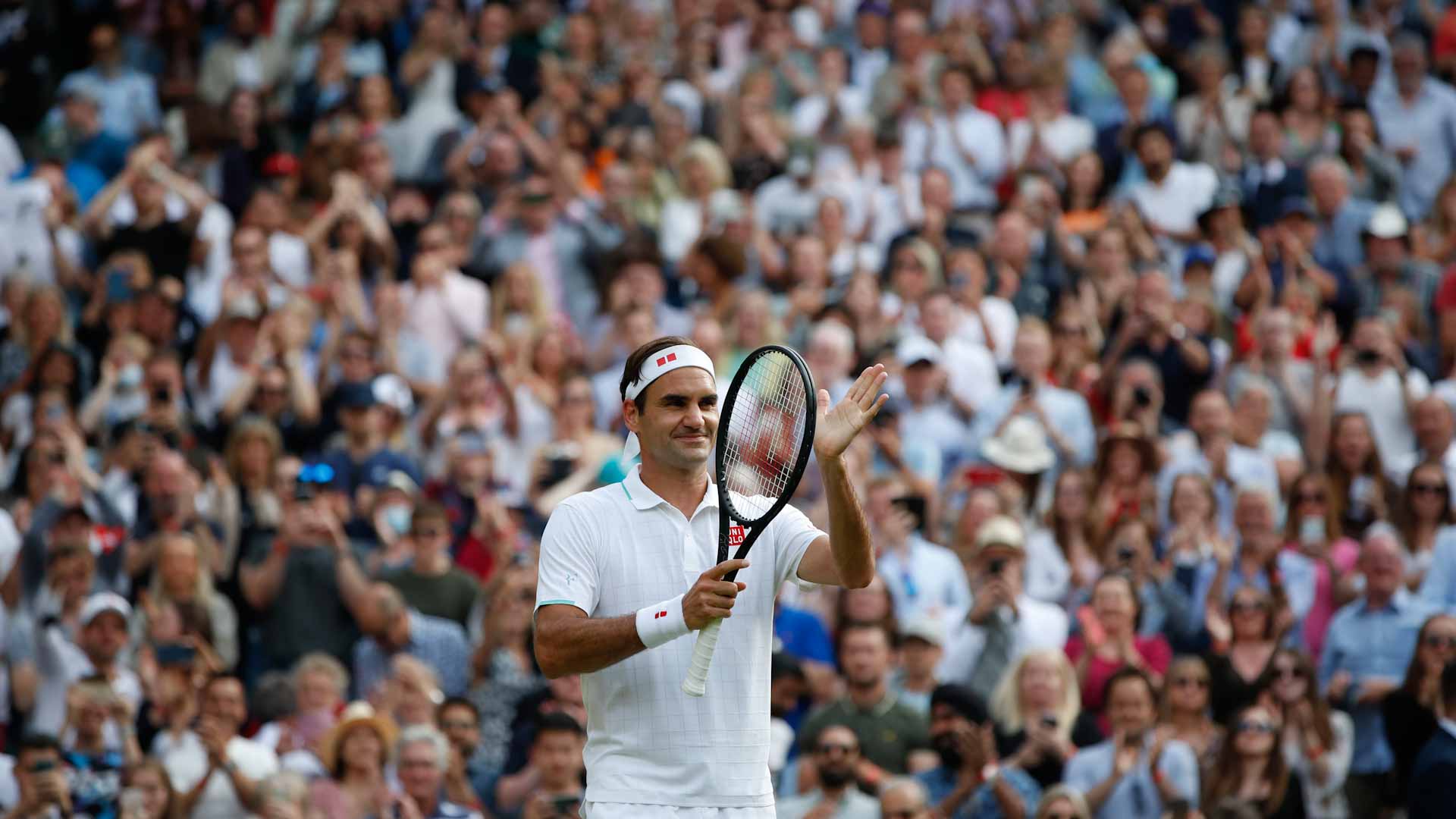 Image for the title: Federer gets his sparkle back as sun shines at Wimbledon 