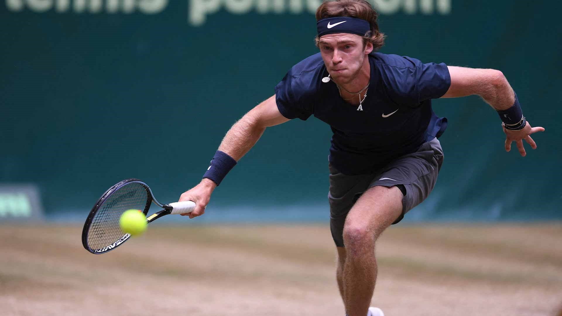 Image for the title: Rublev digs deep to reach Halle semi-finals 