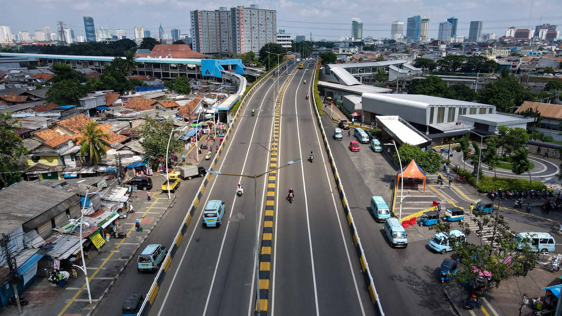 Image for the title: Indonesian police block streets on first day of COVID19 curbs 