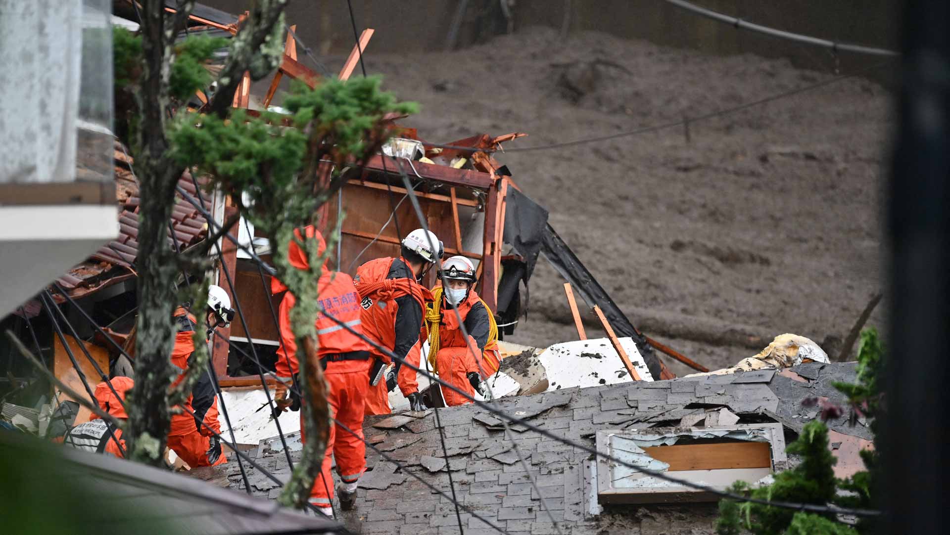 Image for the title: Japan resumes rescue work after deadly landslides 