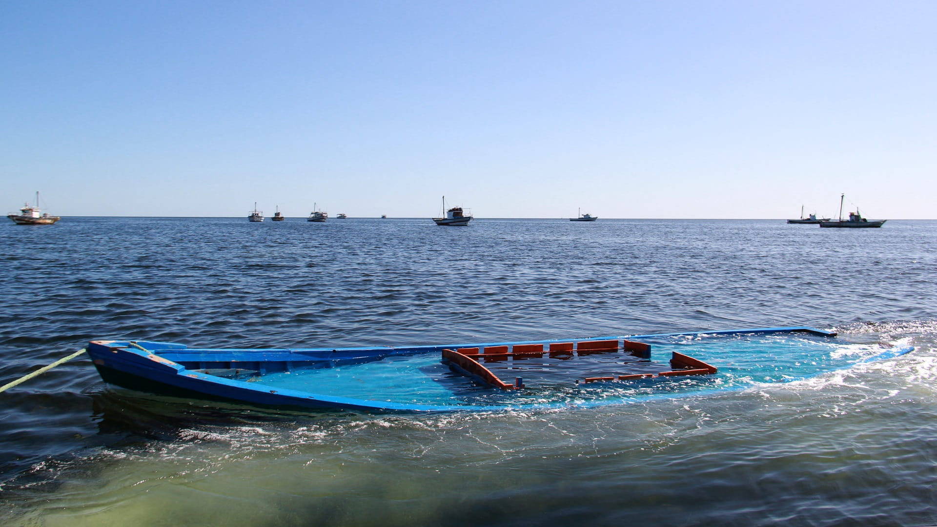 Image for the title: At least 17 migrants die after boat sinks off Tunisia 