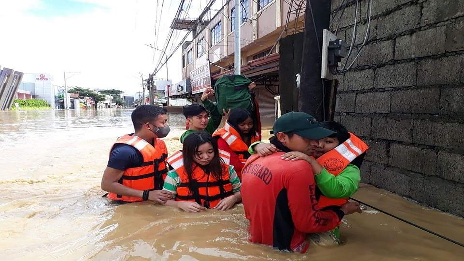 Image for the title: Philippines evacuates thousands as monsoon rains flood cities 