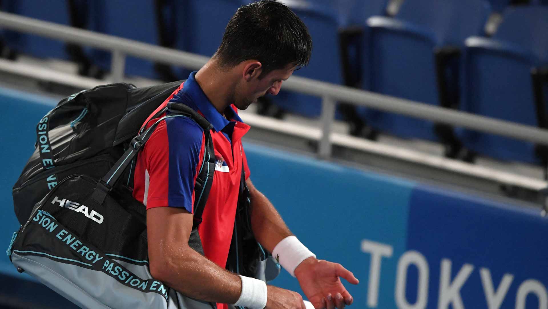 Image for the title: Djokovic loses to Zverev at Olympics, ending Golden Slam bid 