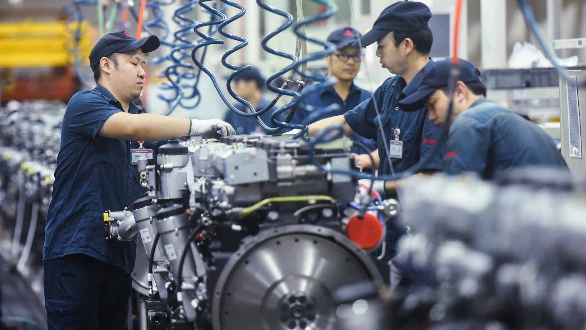 Image for the title: China's factory activity grows, but input costs weigh 