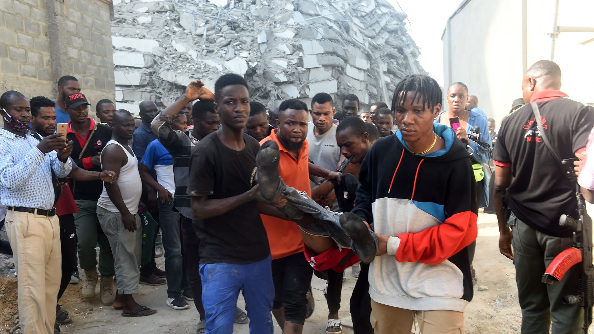 Image for the title: Nigeria rescuers pull 2 survivors from collapsed Lagos building 