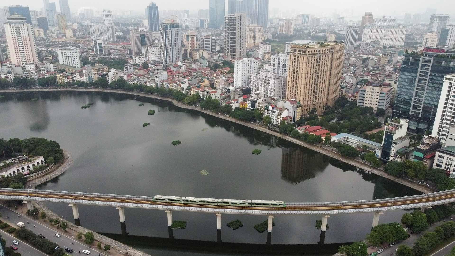 Image for the title: Motorbike-clogged Hanoi rolls out first urban railway 