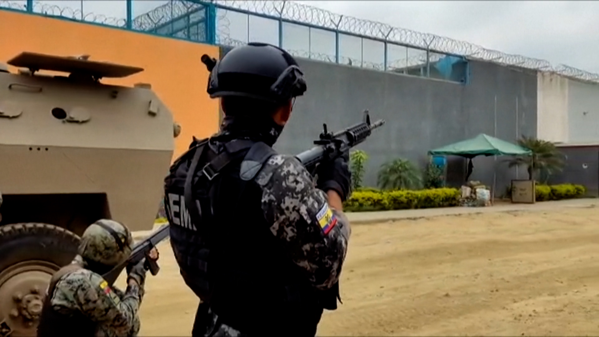 Image for the title: Ecuador military, prison heads resign after jail riot