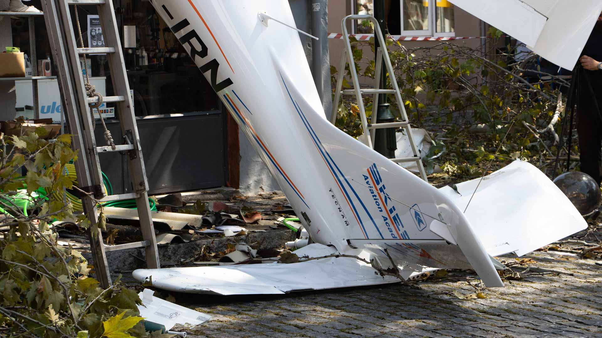 Image for the title: Small plane crashes into empty building outside Milan, 8 die 