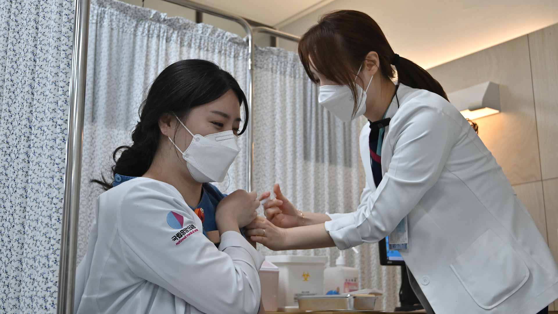 Image for the title: S.Korea eases curbs in first step toward 'living with COVID-19' 