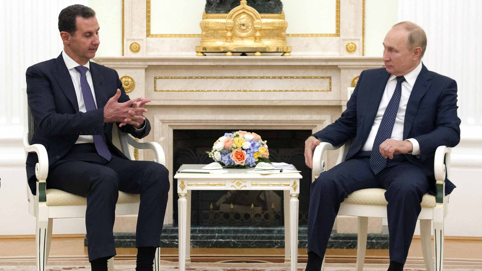 Image for the title: Putin criticises foreign forces in Syria meet with Assad 