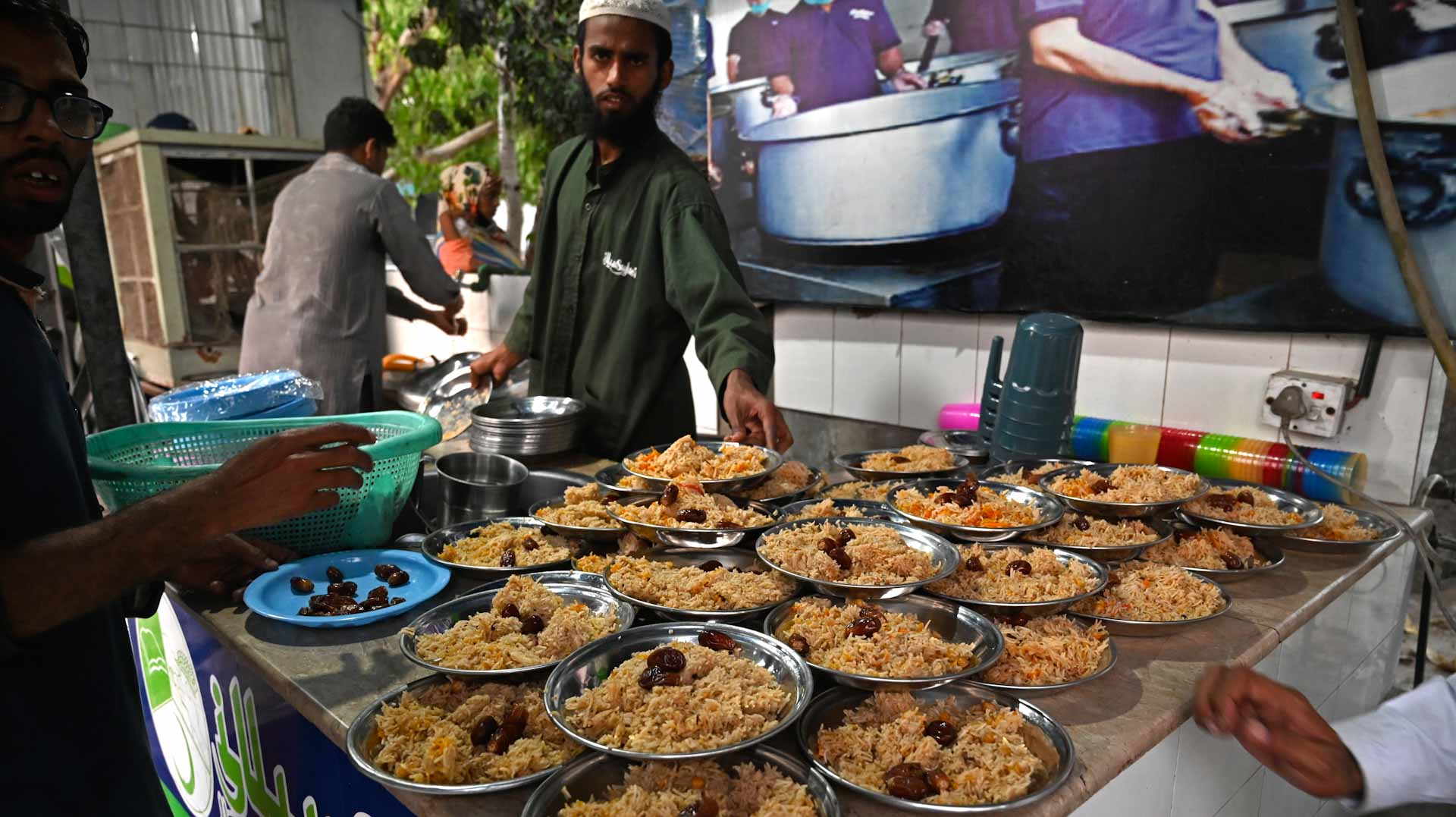 Image for the title: Sweet smell of Ramadan tempts as South Asia's Muslims fast 