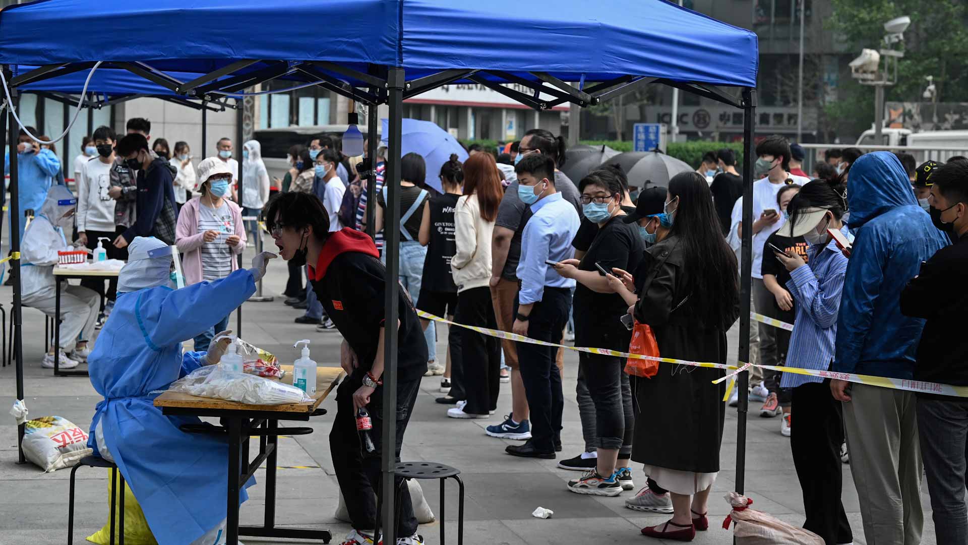 Image for the title: Beijing Covid spike prompts mass testing, panic buying 