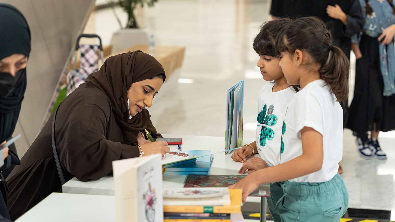 Image for the title: EBF concludes with a book signing ceremony by over 150 authors 